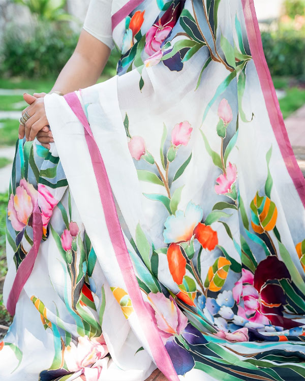 Handpainted pure chiffon saree laden with Iris Flowers.