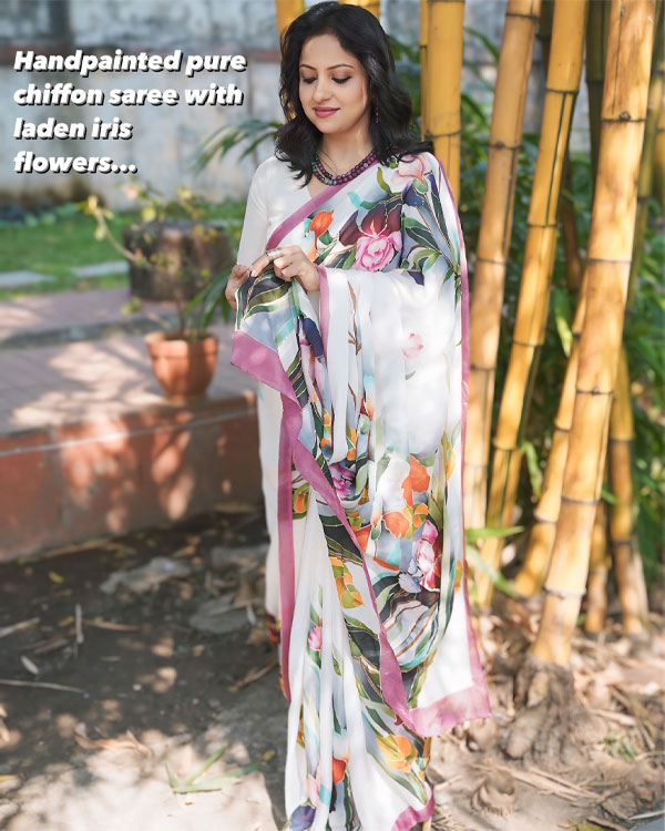 Handpainted pure chiffon saree laden with Iris Flowers.