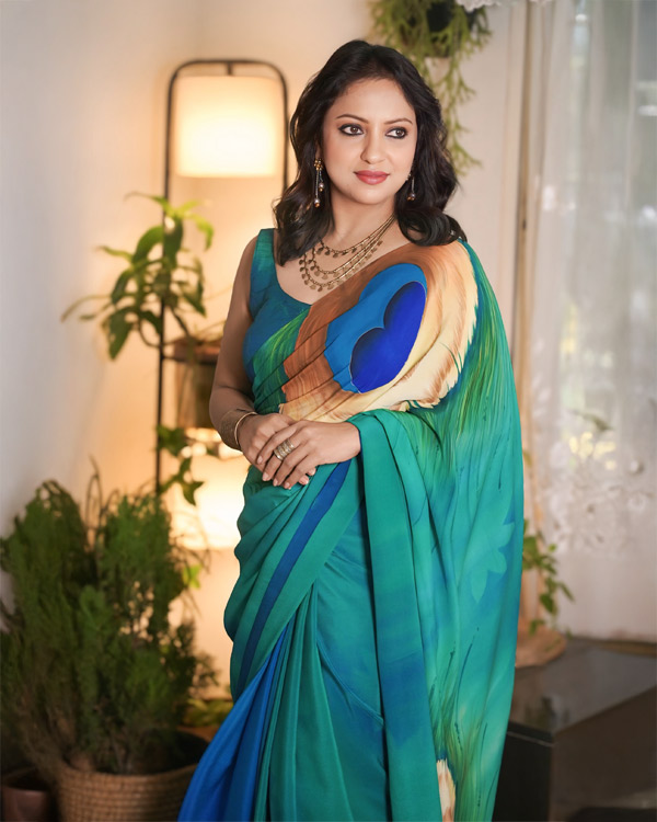 hand painted, pure crêpe, Silk saree in peacock shades.