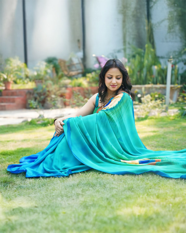 hand painted, pure crêpe, Silk saree in peacock shades.