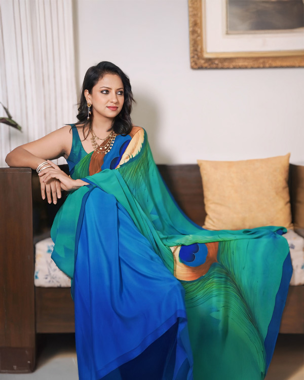 hand painted, pure crêpe, Silk saree in peacock shades.